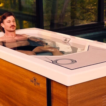Woman closing her eyes and focusing in cold water.
