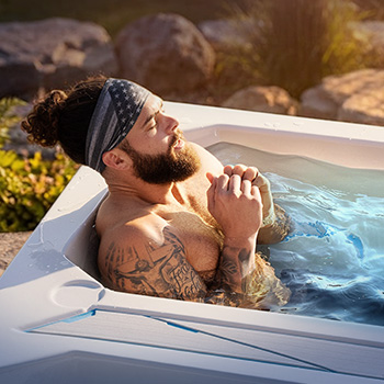 Person sitting in a cold tub.